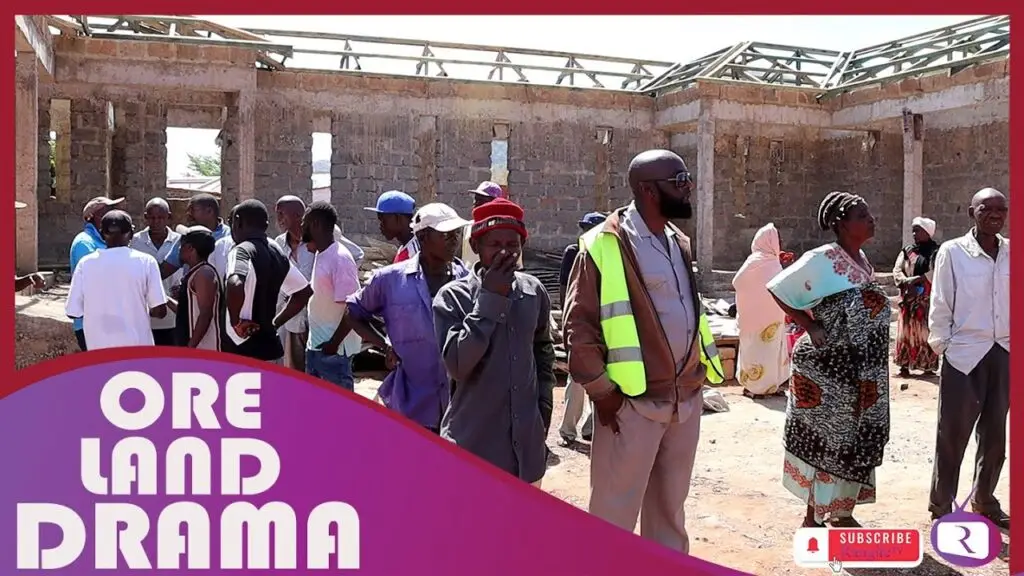 Construction site with gathered people.